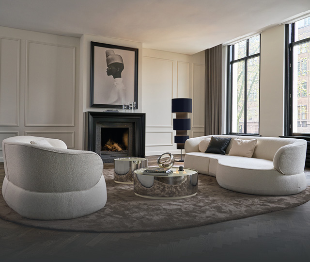 Wohnzimmer mit Designer-Sofa und Sessel, Link zu Bielefelder Werkstätten