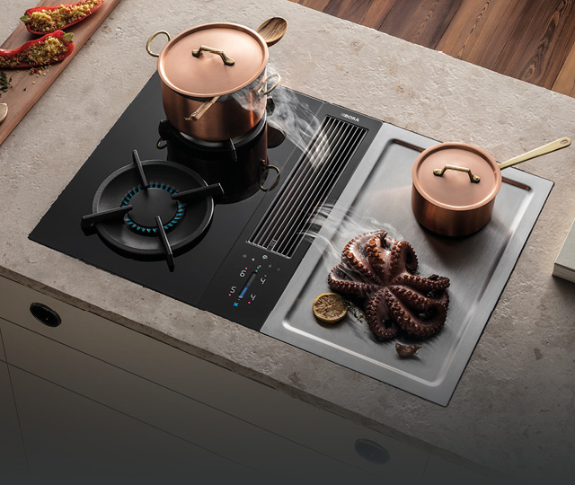 Kochfeld mit integriertem Abzug und Töpfen auf Arbeitsplatte, Link zu Bora Kochfeld