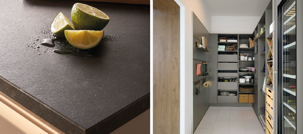 Detail einer dunklen Küchenarbeitsplatte aus Stein mit Limetten sowie Blick in eine moderne Speisekammer mit Regalen, Vorratsschubladen und integriertem Weinkühlschrank. Beispiel für funktionale Küchenplanung mit viel Stauraum.