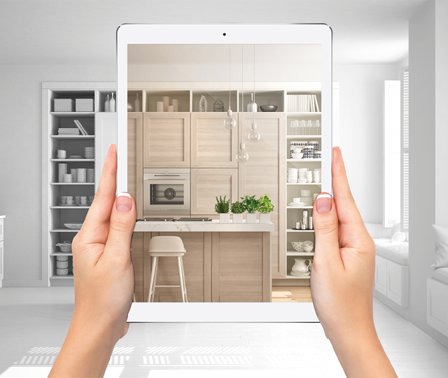 Hände halten ein Tablet mit Visualisierung einer modernen Küche während der digitalen Küchenplanung im Küchenstudio