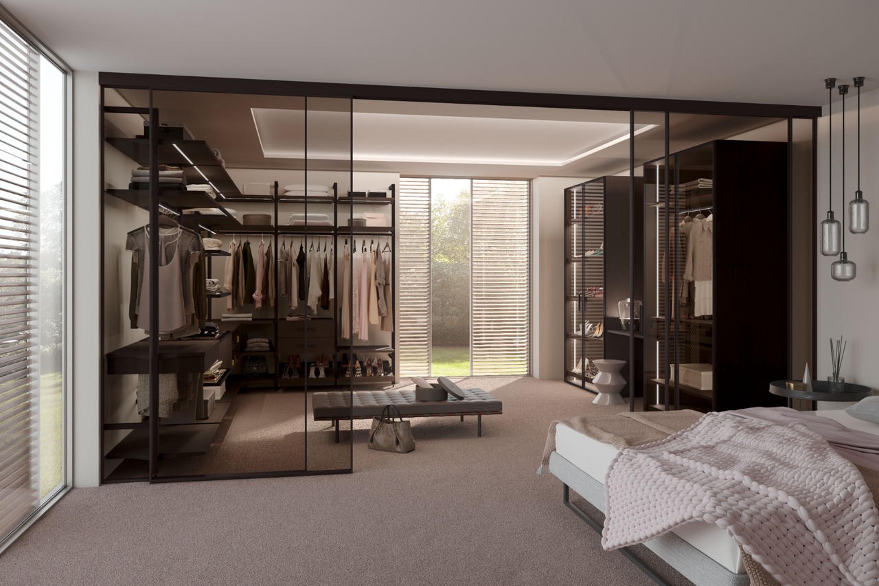 Schlafzimmer mit grünem Bett und offenem Wandschrank